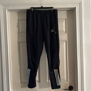 Adidas joggers. Medium.  Black with white strips.  Very nice condition.